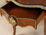 a small desk with a drawer on it