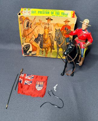 a figurine of a man riding a horse next to a flag