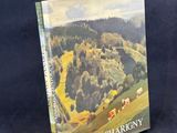 un livre dont la couverture représente un paysage