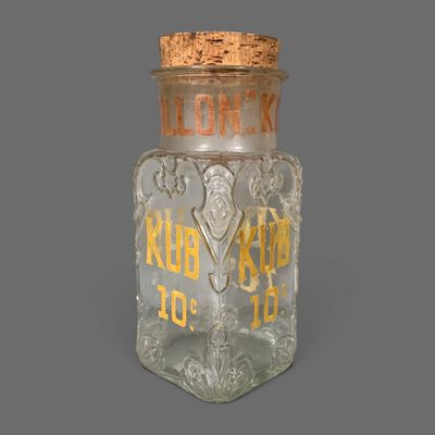 a glass bottle with a cork stopper on it