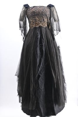 a black and gold dress on a mannequin mannequin mannequin mannequin mannequin mannequin mannequin manne