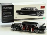 a black model of a car with its doors open
