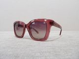 sunglasses on a table with a white table cloth and a white wall