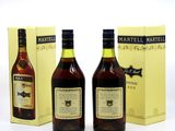 two bottles of martella and a box of wine on a white surface