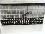 black and white photo of a group of men in uniform posing for a picture