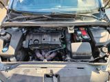 the engine of a car with its hood open and the hood up