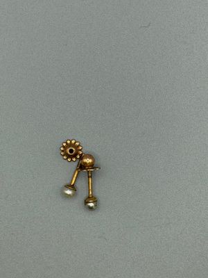 an image of a pair of gold earrings with pearls on them