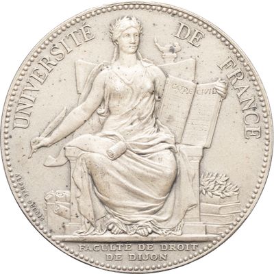 l'image d'une pièce d'argent représentant une femme assise sur une chaise