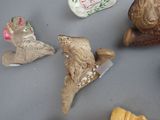 several figurines of different shapes and sizes on a table