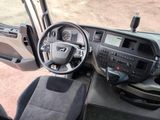 a view of the inside of a vehicle from the driver ' s seat
