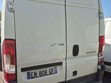 a white van that is parked in a parking lot