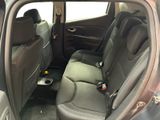 the back seats of a car with a cup holder in the passenger seat