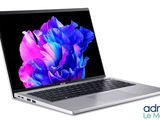 an open laptop computer sitting on top of a white surface