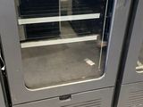 two ovens that are sitting in the middle of a room