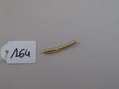 a picture of a piece of metal with a tag attached to it