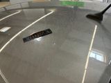 a remote control sitting on top of a glass table