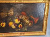 a picture of a painting of fruit in a gold frame
