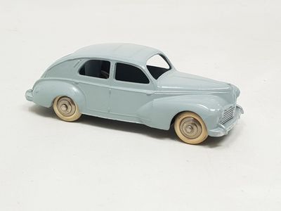 a toy car that is sitting on a white surface