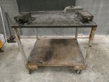 a metal table that has some tools on top of it