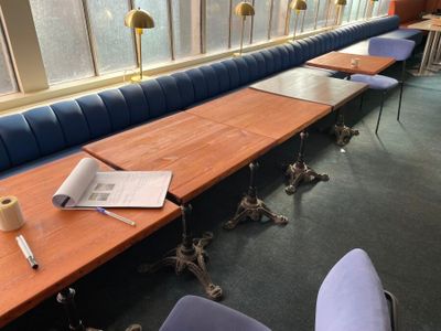a long table with a bunch of papers on it