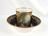 a cup and saucer with a picture of a woman on it