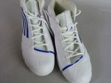 pair of white and blue tennis shoes sitting on top of a white surface