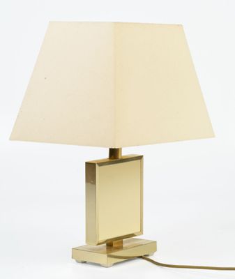 lamp in the shape of a cube with a beige shade on a white background