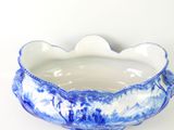 a blue and white bowl on a white table