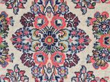 a close up of a rug with a floral design on it