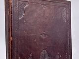 an old book sitting on top of a wooden table