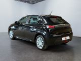 the back of a black car in a white room