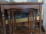 two tables that are on top of a dresser