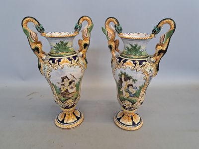 two vases that are sitting on a table