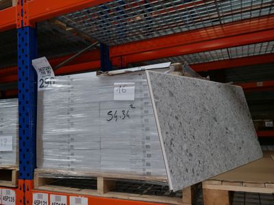 a large stack of boxes on a pallet in a warehouse