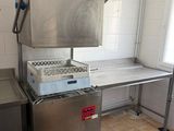 a kitchen with a stove and a sink in it