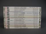 a lot of books that are stacked on top of each other