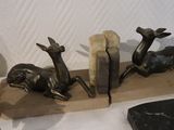 three bookends that are sitting on top of a table