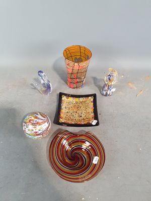 a bowl, plate, and bowl of food on the floor
