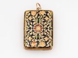an antique gold and enamel locke with a floral design on it