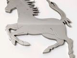 a metal horse that is standing on its hind legs