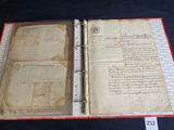 an old book with writing on it sitting on a table