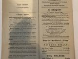 an old newspaper with a bunch of information on it sitting on a table
