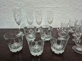 a lot of wine glasses sitting on a table