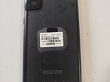 a close up of a cell phone with a sticker on it