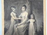 une vieille photo représentant une femme et deux jeunes filles