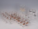 a lot of glasses that are sitting on a table
