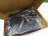 a box with a laptop in it that is wrapped in plastic
