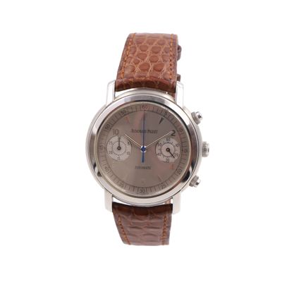 a close up of a watch on a white background