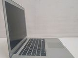 a laptop computer sitting on a table with a white background