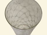 a glass bowl sitting on a table with a white background